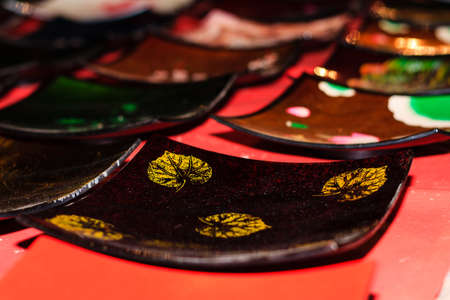 Colorful bowls, handicrafts on night market at Luang Prabang - Laos