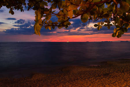 Amazing beautiful wide orange colorful sunset in Thailand Ko Lanta Island Beach, sun, sea, stones,...