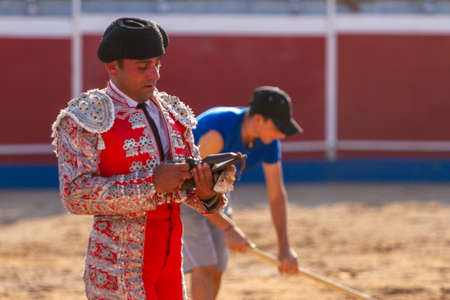 a Spanish bullfighter during his performance in the bullfight
