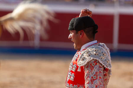 a Spanish bullfighter during his performance in the bullfightの写真素材