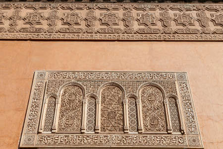 Detail of a facade with Islamic inscriptions of the El Badi Palaceの写真素材