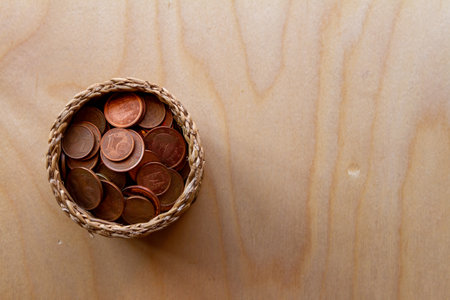 euro coins in a basket suggesting the concept of savings