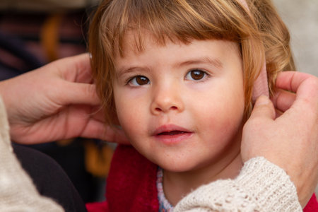 Close up portrait of a cute little girl with long blonde hair.