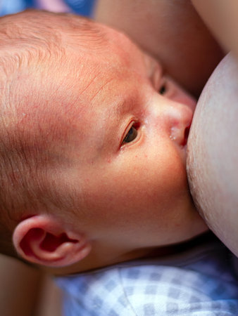 Mother breastfeeding her newborn baby.