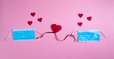 Covid background for valentines day with maskの写真素材