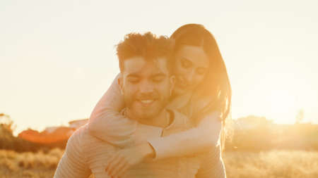 Boy and Girl couple hug and walk together in the natural parkの写真素材