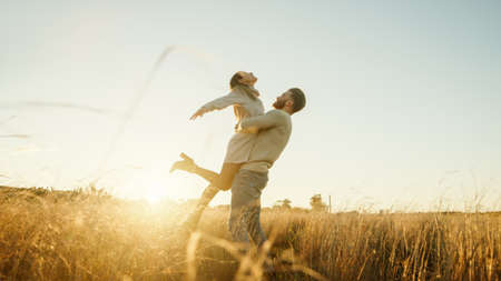 Boy and Girl couple hug and walk together in the natural parkの写真素材