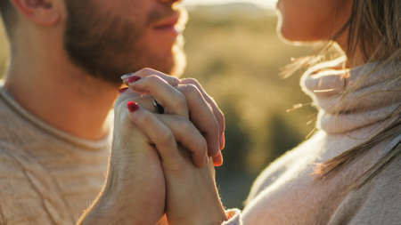 Boy and Girl couple hug and walk together in the natural parkの写真素材