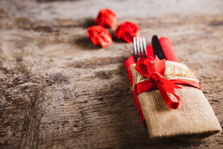 Background for valentines restaurant with covered kitchenware on tableの写真素材