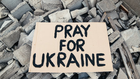 Abandoned billboards on the debris of buildings destroyed by bombing in Ukraineの写真素材