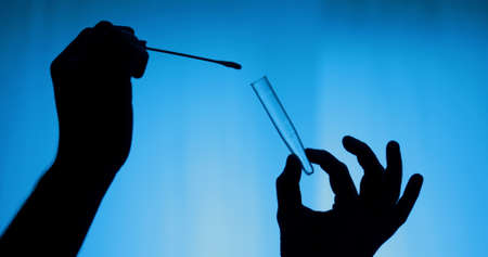 Silhouette of swab test for covid 19の写真素材