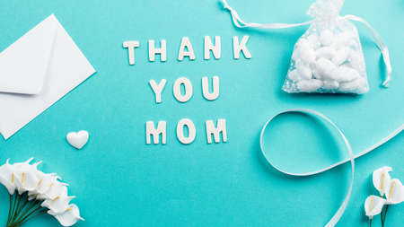Thank you mom text on blue background for mothers dayの写真素材