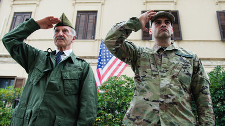 Veteran and Military Son Salute in Front of Base on Memorial Day