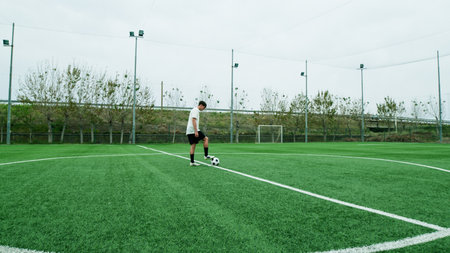 Teenager Does Freestyle Soccer Dribbles In The Fieldの写真素材