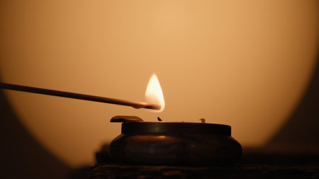 Faint Flame Diwali Candle In Silhouetteの写真素材