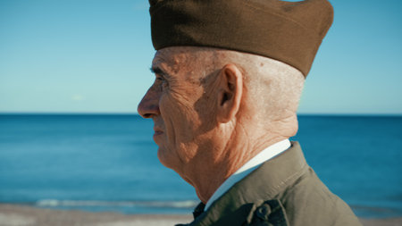 US Veteran Walks At The Beach Alongside The Ocean