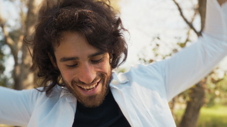 Happy Long Hair Doctor Dancing Music In The Park Outside The Hospitalの写真素材