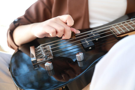 Hands Girl Plays The Bass Musical Instrument Among The Trees In The Park