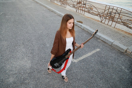 Girl Plays The Bass Instrument Music In The Street