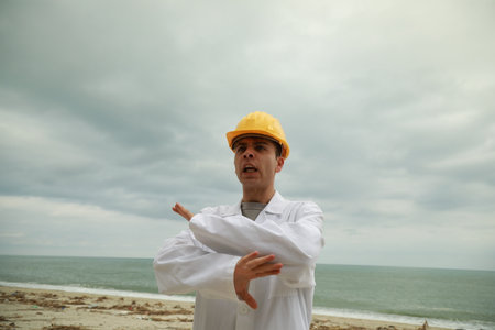 Engineer Angry About Bad Work Done By Workers Nervously Scolding Them On Beach