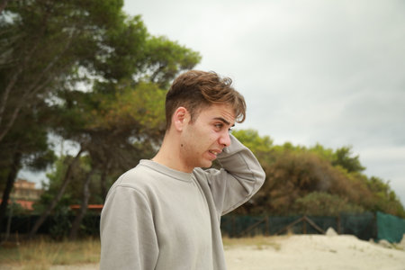 Boy With Curiosity Expression On Face Outdoorsの写真素材