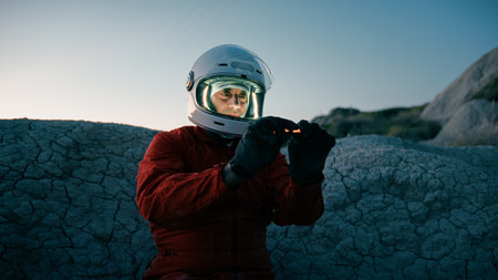 Astronaut Turns On An Orange Chemical Light To Illuminate The Night
