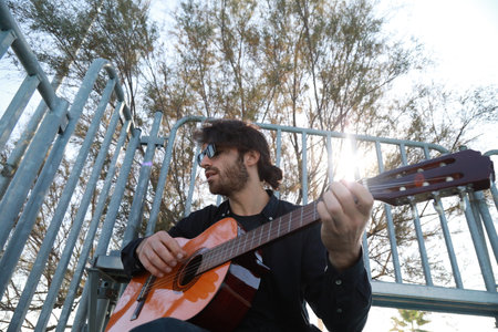 Man Plays Music With Classical Guitar Inexpensive Instrument