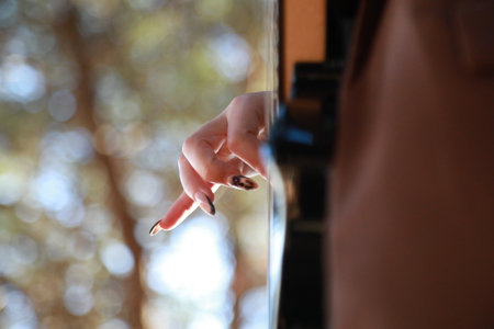 Girl Plays Bass Musical Instrument Among Trees In Mountainsの写真素材