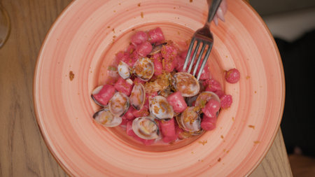 Fork Inside The Gourmet Dumplings Dish With Clams