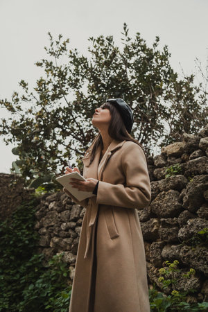 Woman With French Hat In The Small Italian Village Finding Inspirationの写真素材