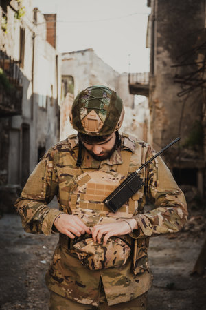 Soldier Puts On Gloves Before Starting The Operation In The Cityの写真素材