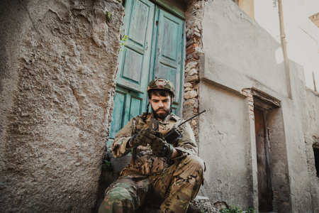 Young Soldier Opens The Compass To Understand His Locationの写真素材