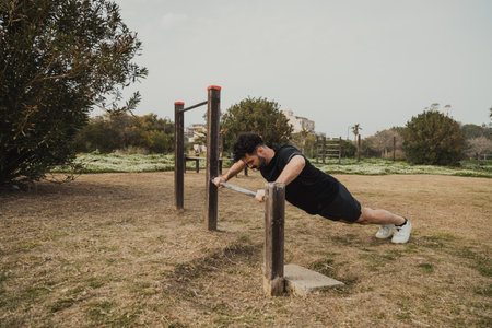 Man Does Push Ups Sport Exercise In The Park