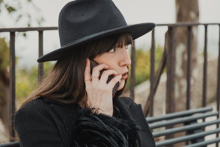 Elegant Dressed Woman On The Town Bench Having A Fun Call Close Up