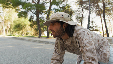 Soldier Crawls On The Ground And Smiling Approaches A Cat To Save Itの写真素材