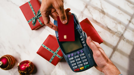 Electronic payment by card the POS for Christmas gift item during Black Fridayの写真素材
