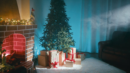 Beam of Light Illuminates Christmas Tree Next to Fireplaceの写真素材