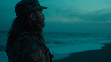 Silhouette of a soldier saluting America Memorial Day on a nighttime beach