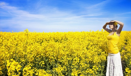 Young business woman relaxing on golden meadow
