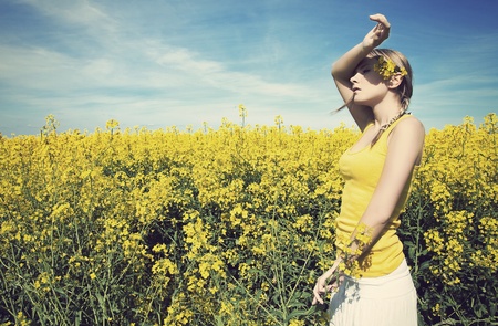 Young business woman relaxing on golden meadow