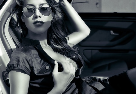 sexy business woman in the car の写真素材