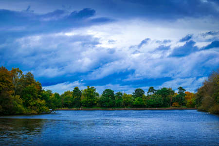 Bright sky overlooking a lakeの写真素材