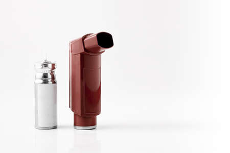 Brown MDI Inhaler. Asthma and Allergy aerosol for people with respiratory problems. White neutral background.の写真素材