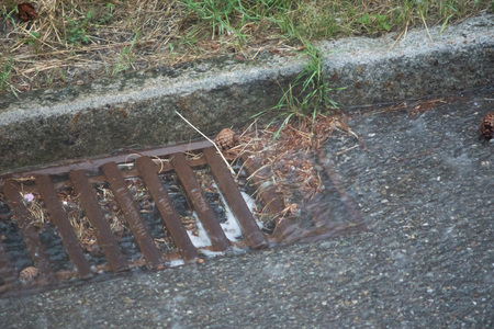 Heavy rain and the drain cloggedの写真素材