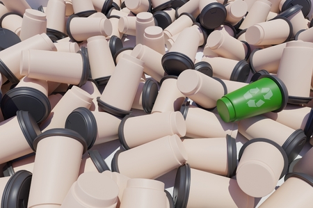 heap of empty to go coffee cups with one in green with recycling simbolの写真素材