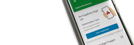 Corona warning app on a smartphone displays the test result - Incorrect - German words on the pictureの写真素材