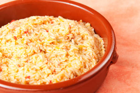 Rice with tuna and peppers on a table with orange tableclothの写真素材