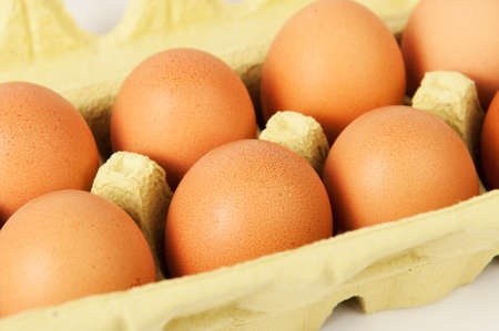 Yellow box containing fresh chicken eggs