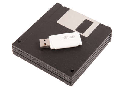 Old diskette with a new USB memory of 32 gigabytes