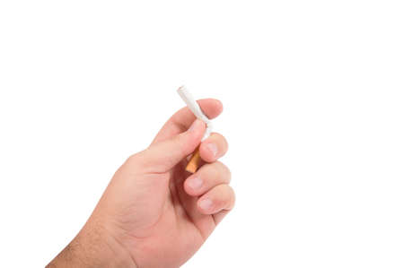 Hand wringing cigar on an isolated white backgroundの写真素材